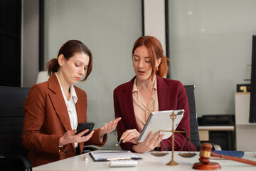 Lawyer businesswoman and two business partners working together in office.