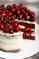 Tasty cherry cake on table
