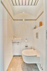 A sleek, modern bathroom featuring minimalist design elements, clean lines, and a bright, airy atmosphere, perfect for relaxation and comfort.