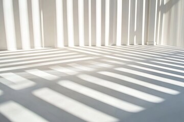 Obraz premium Sunlight casts long, parallel shadows through blinds onto a white floor