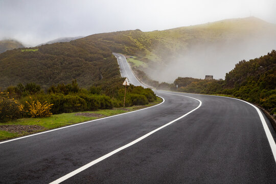 road on a foggy rainy day