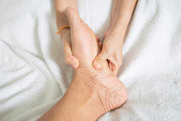 Foot massage in a spa to relax the muscles of the feet and body.