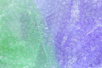 Purple and green plastic bubble wrap texture background, Polyethylene bubble wrap, from above view