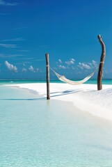Hammock over Clear Tropical Lagoon, White Sand Beach and Relaxation Escape