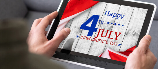 american national flag on the background, tablet pc with sample text. 4th of July Independence Day...