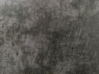Grey background. An old worn-out gray wall. Grey texture.