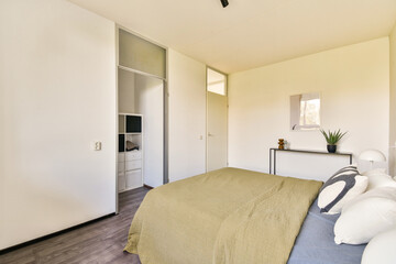 A beautifully designed modern bedroom showcasing minimalistic decor, natural light, and a calming color palette. Perfect for contemporary living.