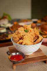 Fully chicken crispy skin on a bowl. Wooden background. perfectly for advertising, receipe, article or commercial purpose anyway