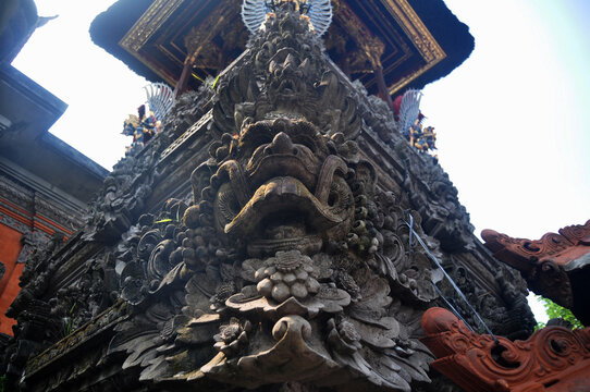 Sculpture and carved antique deity angel god of hindu statue balinese style in Pura Dalem Agung Padangtegal in Mandala Suci Wenara Wana or Monkey Forest at Ubud city in Bali, Indonesia