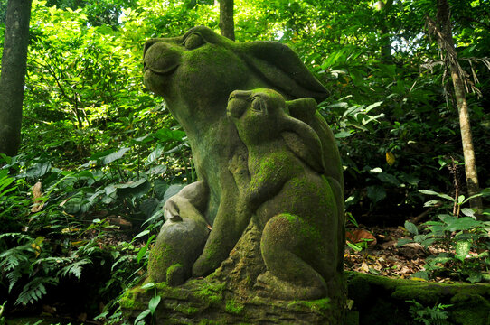 Art sculpture and carved antique deity angel god of hindu statue balinese style in Mandala Suci Wenara Wana or Ubud Sacred Monkey Forest Sanctuary at Ubud city in Bali, Indonesia