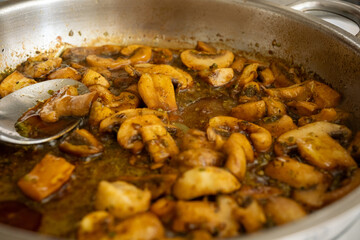 lose-Up of Sautéed Soy-Glazed Mushrooms in a Metal Pan
