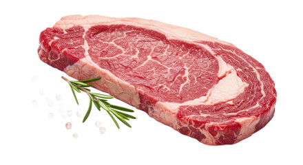 Close up of a raw ribeye steak with rosemary and peppercorns on a black background for food photography