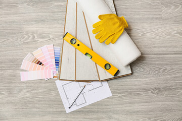 Tools, house project, color palettes and laminate boards on floor