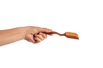 Brown plastic spoon in hand, isolated on transparent background