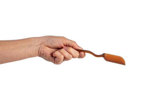 Brown plastic spoon in hand, isolated on transparent background