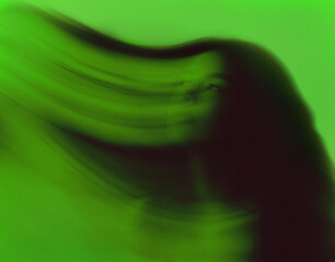 Abstract green portrait with a young woman face