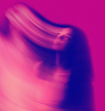 Abstract woman portrait with vibrant colors and motion blur