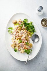 Potato salad with ham and pickled mushrooms