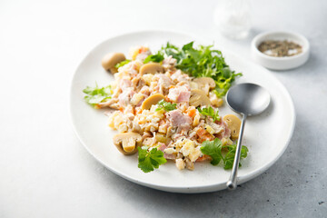 Potato salad with ham and pickled mushrooms