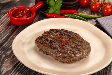 Grilled beef burger cutlet with sauce
