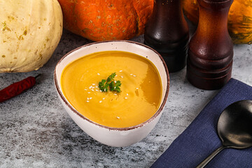 Vegan pumpkin cream soup served sesam