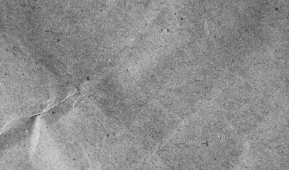 Textured grey paper, aged and recycled, for background designs.