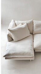White couch with pillows on it