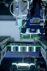 Circuit board moving through assembly line. Electronics component installation, CMD. Automated