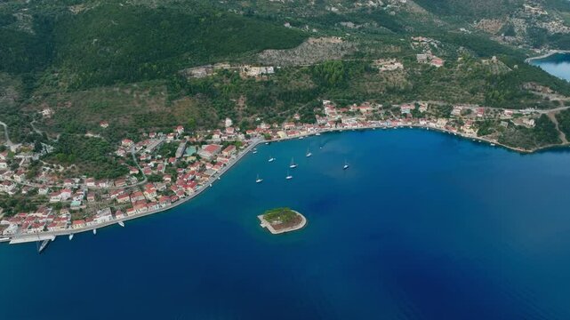 Aerial of Lazareto island surrounded by blue water near Vathy, Ithaca, Greece