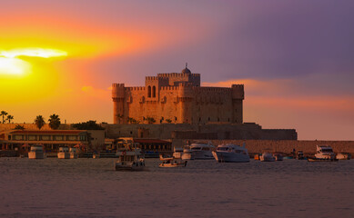 Harbour and boats in Alexandria near Qaitbay Citadel, famous view of Egypt at sunset - Alexandria