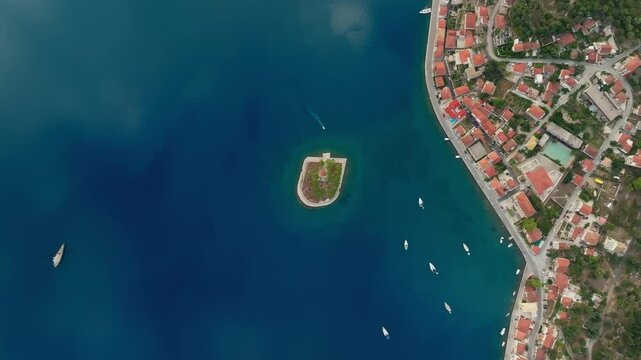 Small Lazareto island surrounded by blue sea near Ithaca&rsquo;s Vathy village, Greece