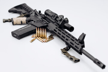 Close-up of rifle with ammunition on white background. Concept of armed forces and arms sales.