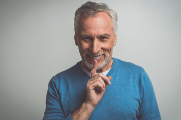Handsome senior  isolated on grey background. Concept about the third age and seniority