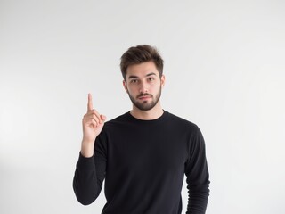 Fototapeta premium Handsome young man pointing up with his finger
