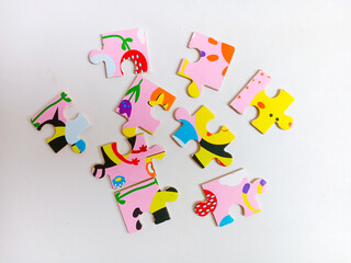 Colorful jigsaw puzzle pieces on white background