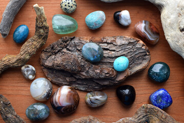 Beautiful gemstones on wooden background, healing crystals. Labradorite, fluorite, lapis lazuli,...