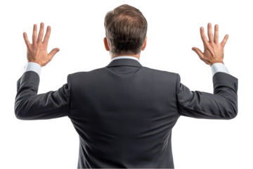 Confident Caucasian businessman in a suit with arms raised against a white background.