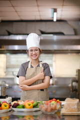 Portrait young teen girl cook student. Cooking class. Culinary classroom. Happy young woman students for cooking in cooking school.