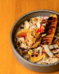 Grilling bananas for a nutritious bowl cozy kitchen food photography close-up view healthy eating concept with peanut butter and toppings