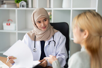 Healthcare and Patient Interaction. A compassionate healthcare professional engaging with a patient in a private consultation setting.