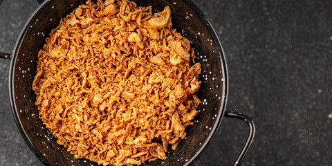 Fried onion crispy onions appetizer vegetables dish fresh delicious gourmet food background on table rustic food top view copy space vegetarian and vegan food