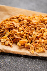 Fried onion crispy onions appetizer vegetables dish fresh delicious gourmet food background on table rustic food top view copy space vegetarian and vegan food