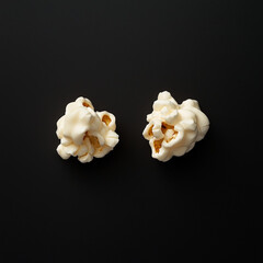  Two Pieces of Popcorn Isolated on Dark Black Background, Macro Shot