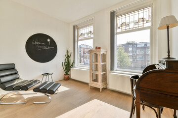 A sleek interior featuring large windows, natural light, and stylish furniture that creates a cozy and inviting atmosphere. A perfect blend of elegance and comfort.