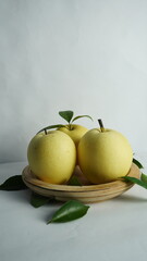 pears on a wooden tray white background
