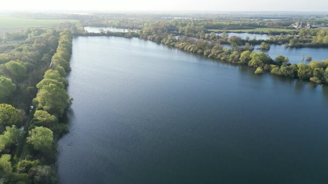Lake Panning View Exhibiting Sun Reflections and Greenery
