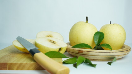 pears on a wooden tray white background