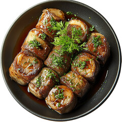 Top view of a delicious looking Rinderroulade on a dark plate isolated on a white transparent background.