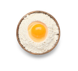 Plate with flour and raw chicken egg on white background