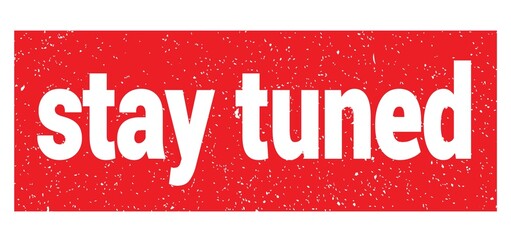 stay tuned text written on red stamp sign.